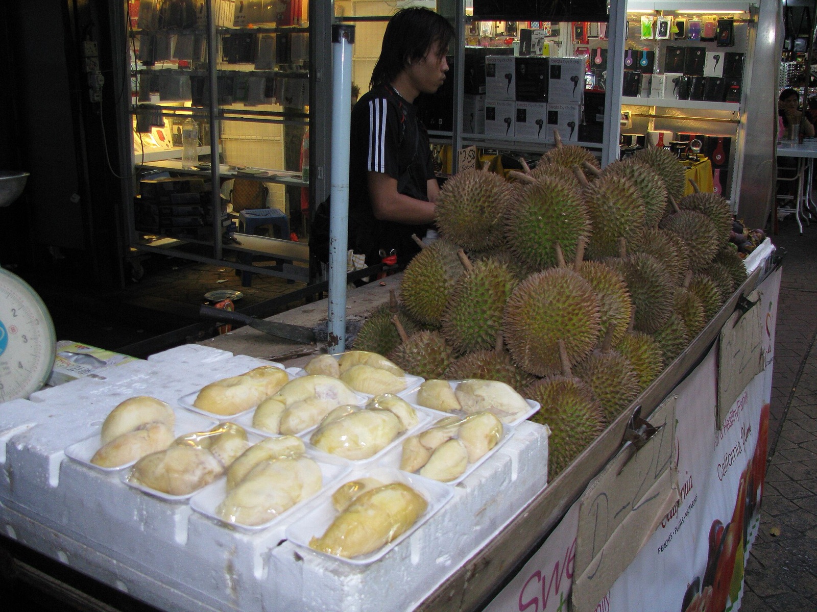 Cracked-open durian fruit showing its golden flesh.