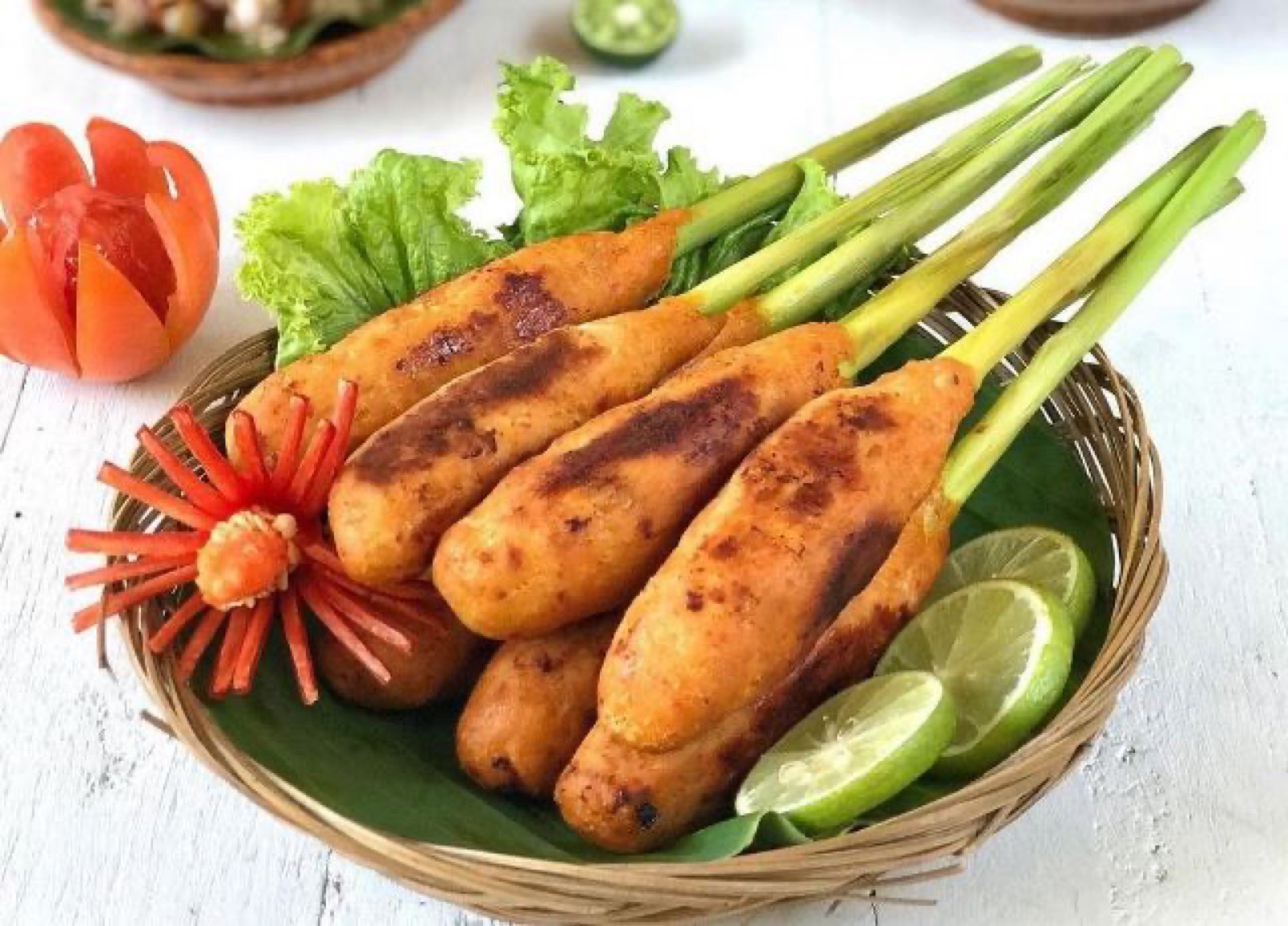 Balinese minced fish satay wrapped on lemongrass stalks.